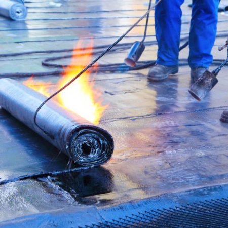 men Crout roof with hot tar